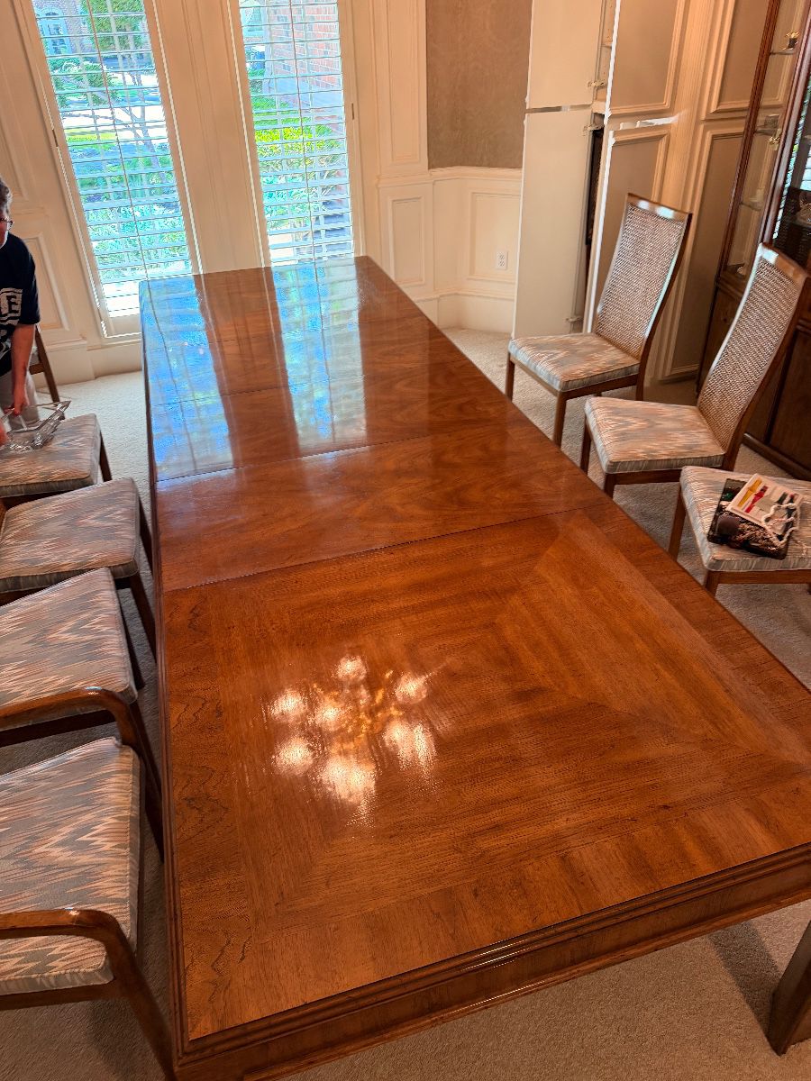 Wood dining table with cane back chairs