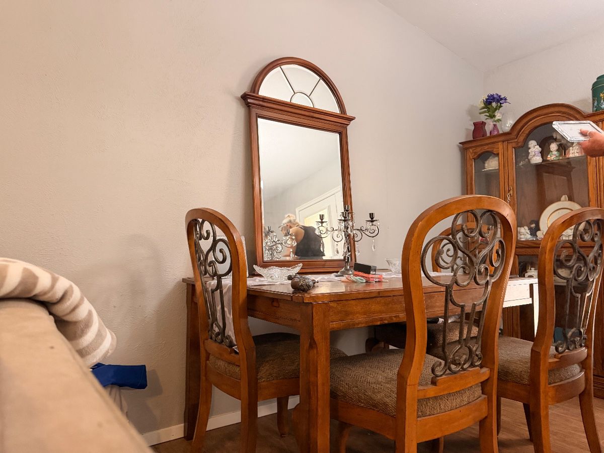 Wood expanding dining table and chairs with arched mirror