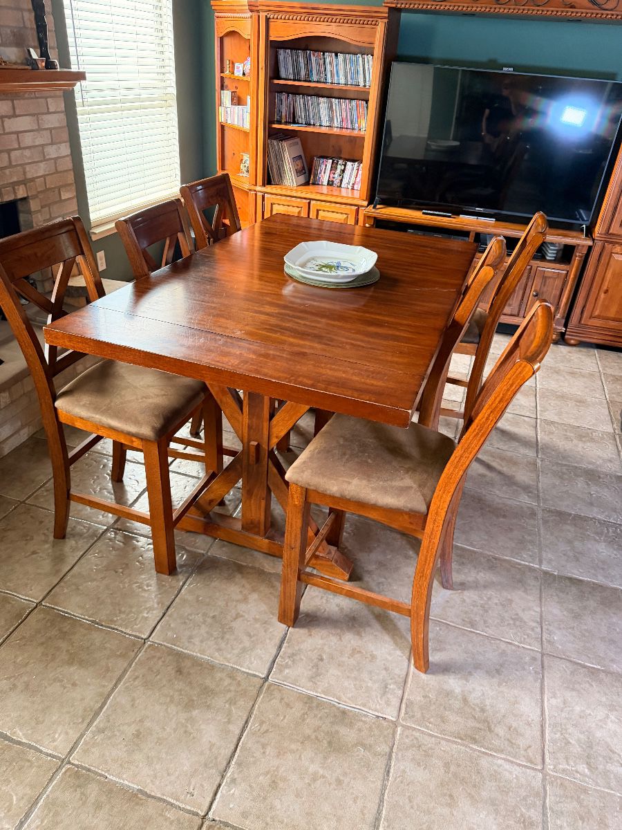 Wooden dining table with chairs in a Grand Prairie home