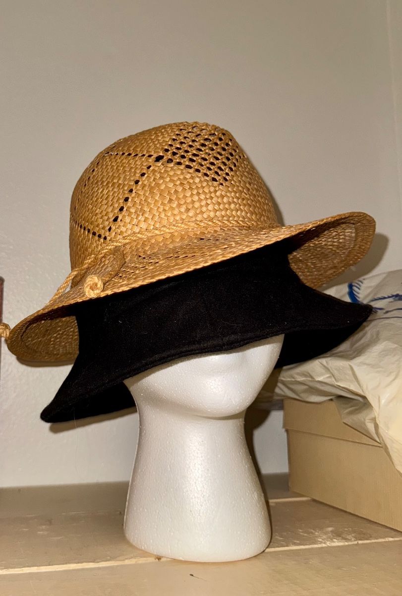 Woven straw hat displayed on a mannequin head